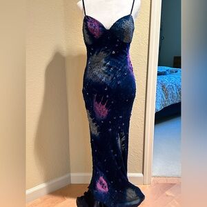 Beautiful form fitting long gown by CECE with paint splash colors and beading